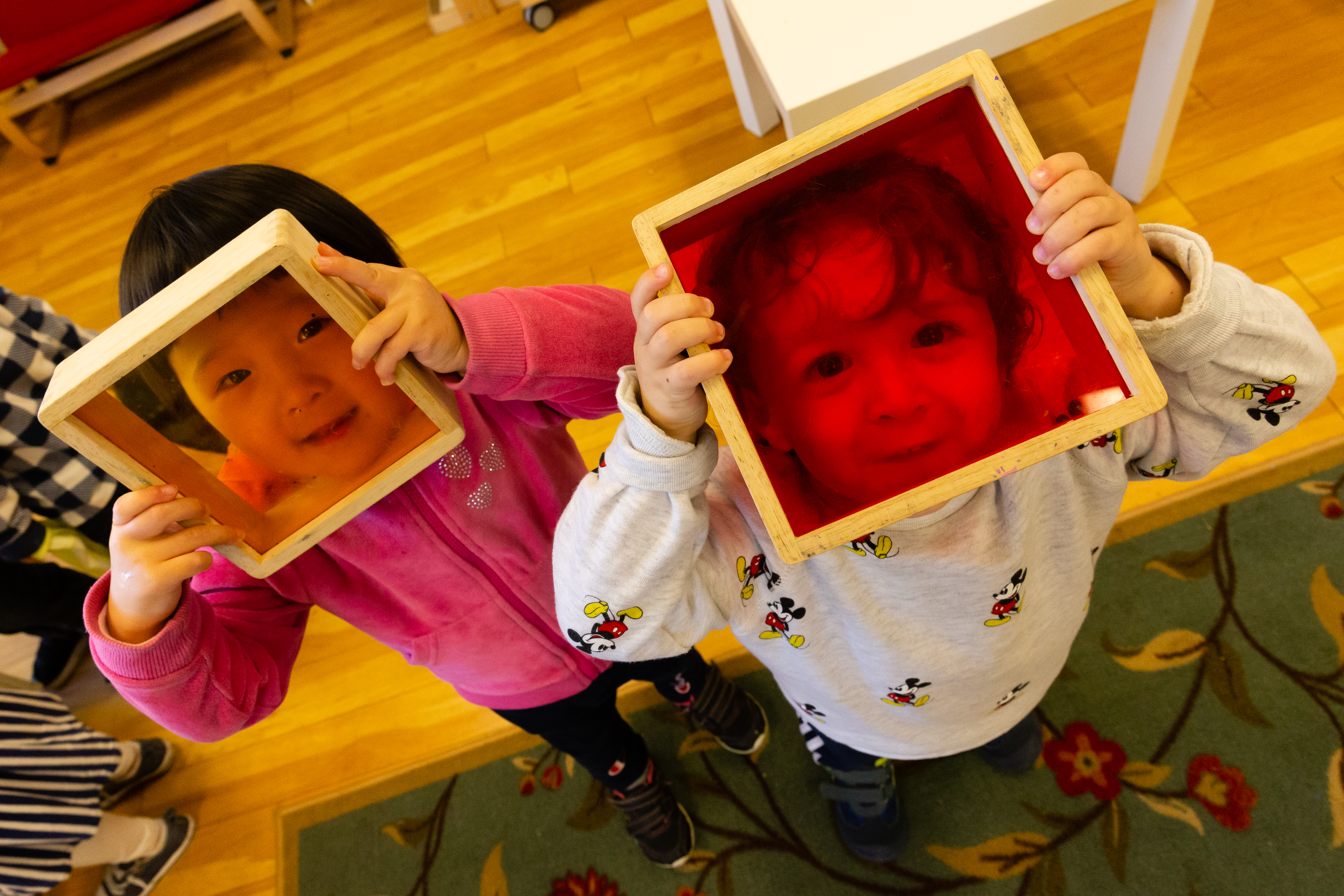 Montessori preschoolers socializing by playing together