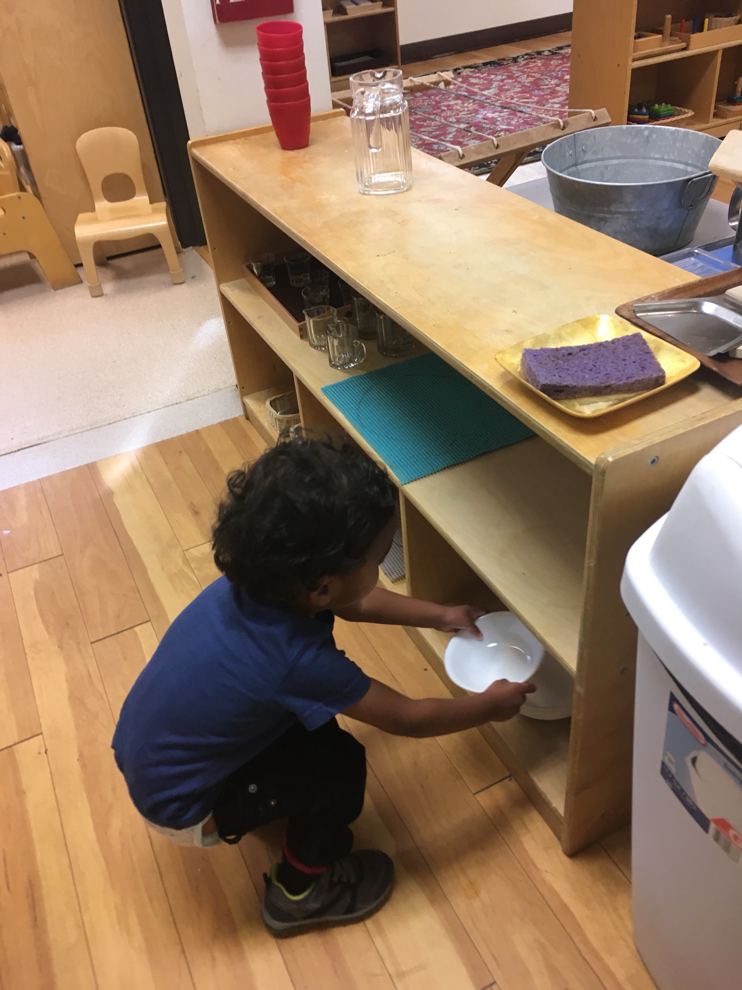 Easy to reach plates for your toddler to help with dinner