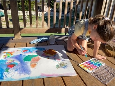 Child independently working outside at Lifetime Montessori school in San Diego