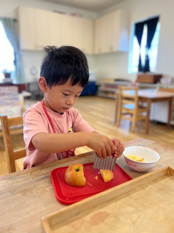 Child preparing lunch independently at Lifetime Montessori School's TK program