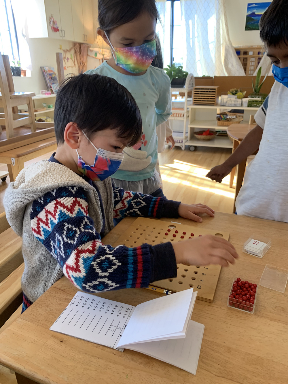 peer-age learning with children in Primary School at Lifetime Montessori School