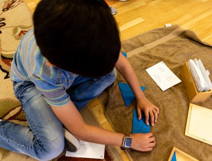 Boy works through puzzles