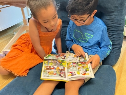 Children reading out loud to each other at Lifetime Montessori School