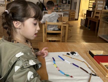 Montessori math uses beads to help children learn basic math concepts, including numbers, operations, and the decimal system