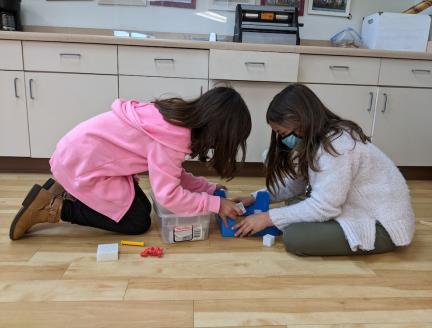 Children in Elementary Montessori Classroom exploring