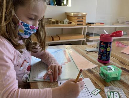 Montessori Primary Student at Lifetime Montessori school doing In-Person Learning