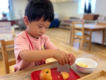 Child preparing lunch independently at Lifetime Montessori School's TK program