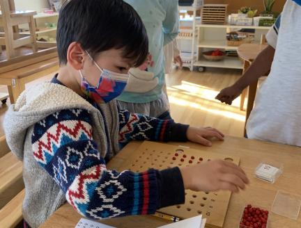 peer-age learning with children in Primary School at Lifetime Montessori School