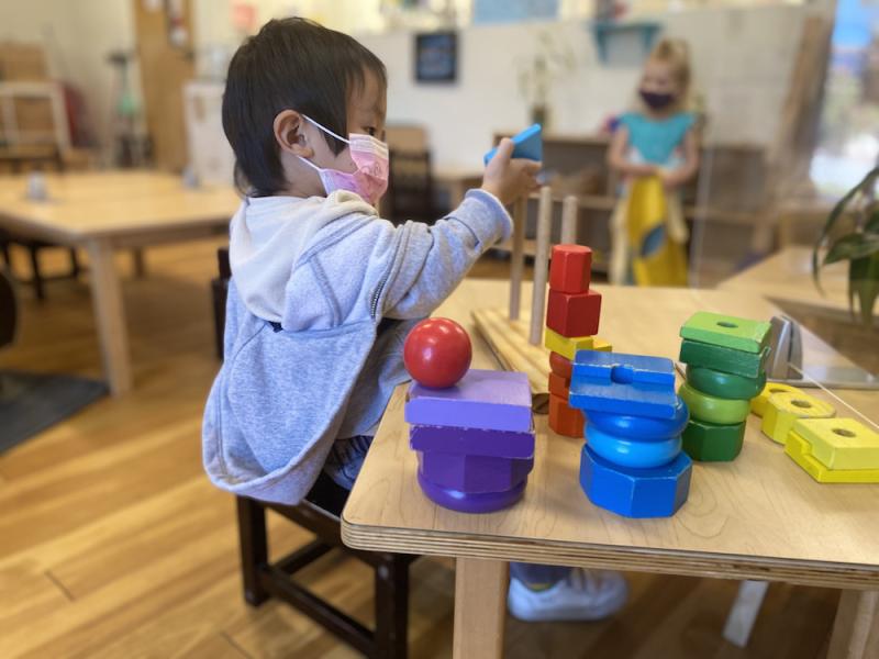 Child independently working in a Montessori Classroom in San Diego