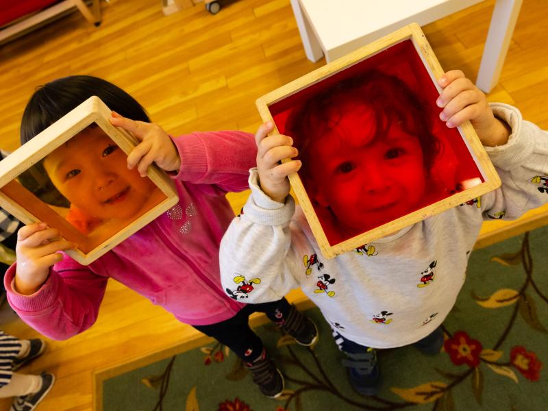 Montessori preschoolers socializing by playing together