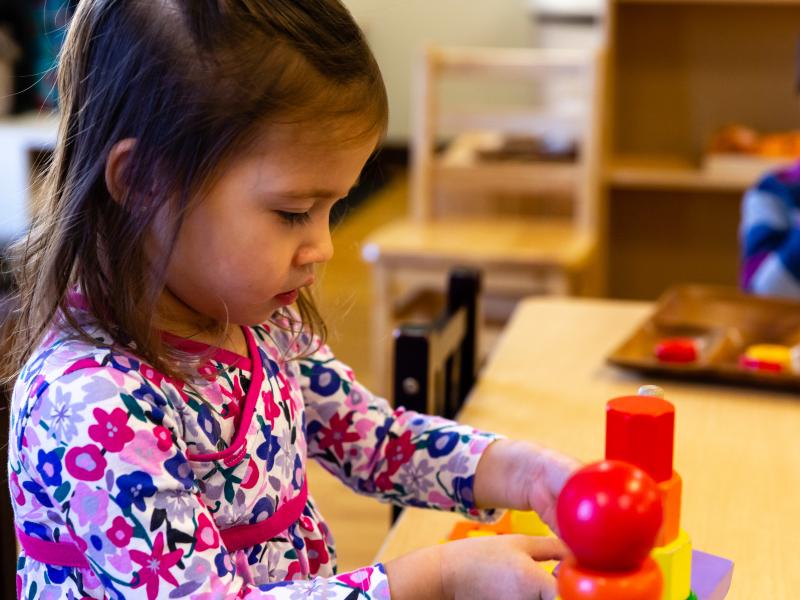 Confident Girl in Montessori Classroom