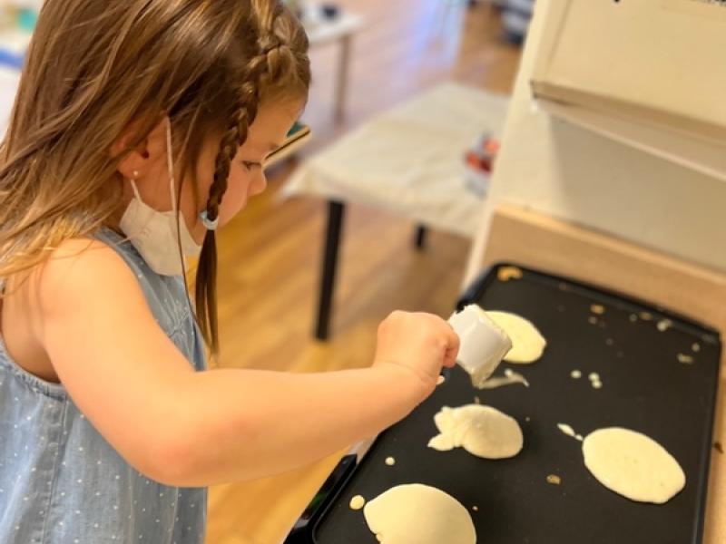 Children at Lifetime Montessori school making breakfast