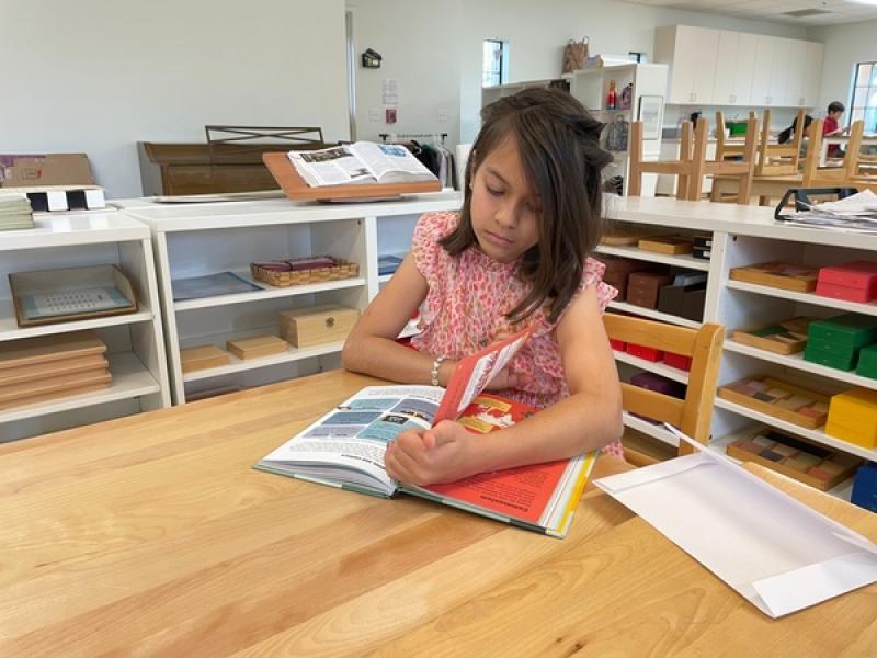 Child learning and working independently at Lifetime Montessori School