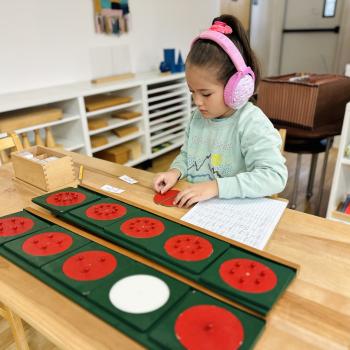 Elementary Child working on advanced math at Lifetime Montessori School in San Diego, Highly rated for Best Montessori School in San Diego