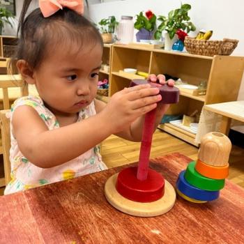 Child playing with puzzle at Lifetime Montessori School in San Diego
