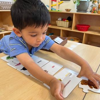 Child playing with puzzle at Lifetime Montessori School in San Diego