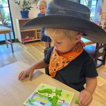 Child playing with puzzle at Lifetime Montessori School in San Diego