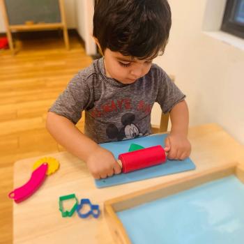 Toddler independently working on art at Lifetime Montessori School 