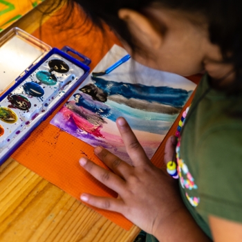 Elementary Child painting at Lifetime Montessori School in San Diego