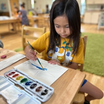 Elementary Child painting at Lifetime Montessori School in San Diego