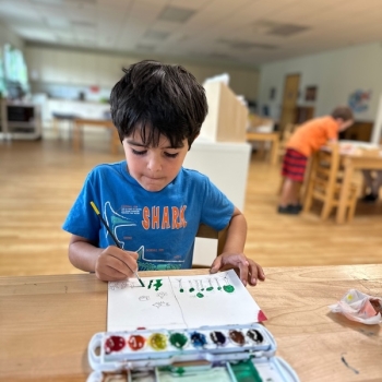 Elementary Child painting at Lifetime Montessori School in San Diego