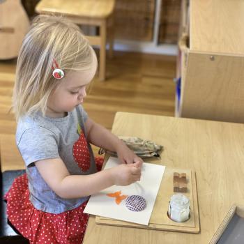 Toddler independently working on art at Lifetime Montessori School 