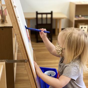 Preschooler Painting at Lifetime Montessori School 