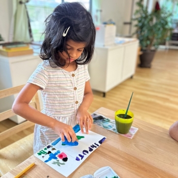 Elementary Child painting at Lifetime Montessori School in San Diego