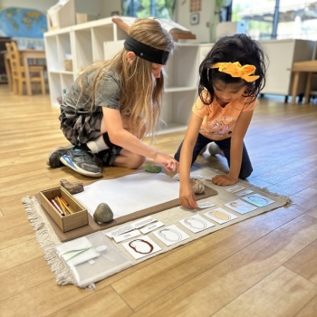 Elementary Child solving math problems at Lifetime Montessori School in San Diego