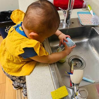 Toddler independently cleaning at Lifetime Montessori School 