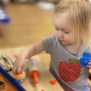 Toddler independently working on art at Lifetime Montessori School 