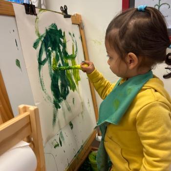 Toddler independently working on art at Lifetime Montessori School 
