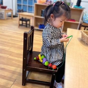 Montessori primary child working at Lifetime Montessori School in San Diego