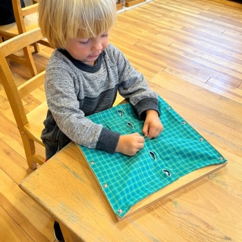 Montessori primary child working at Lifetime Montessori School in San Diego