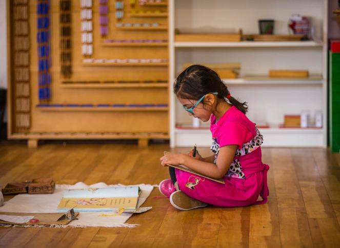 Montessori primary child working at Lifetime Montessori School in San Diego